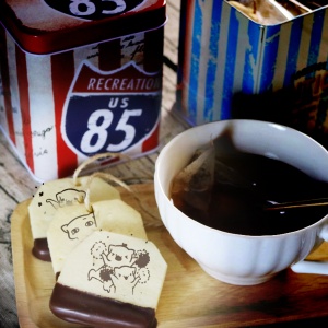 The cat is here, the cat is here, tea bag chocolate biscuits...